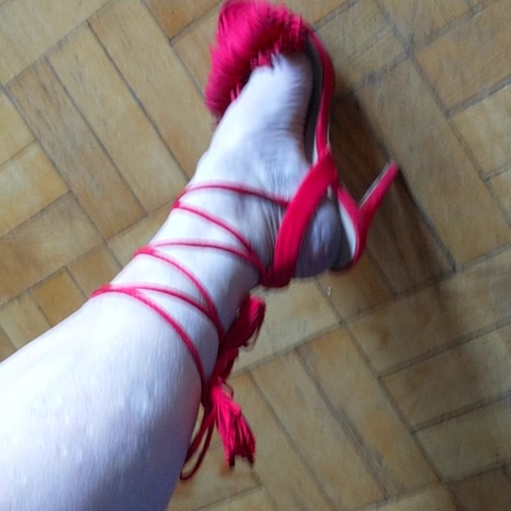 Red faux suede lace up heels with fringe.